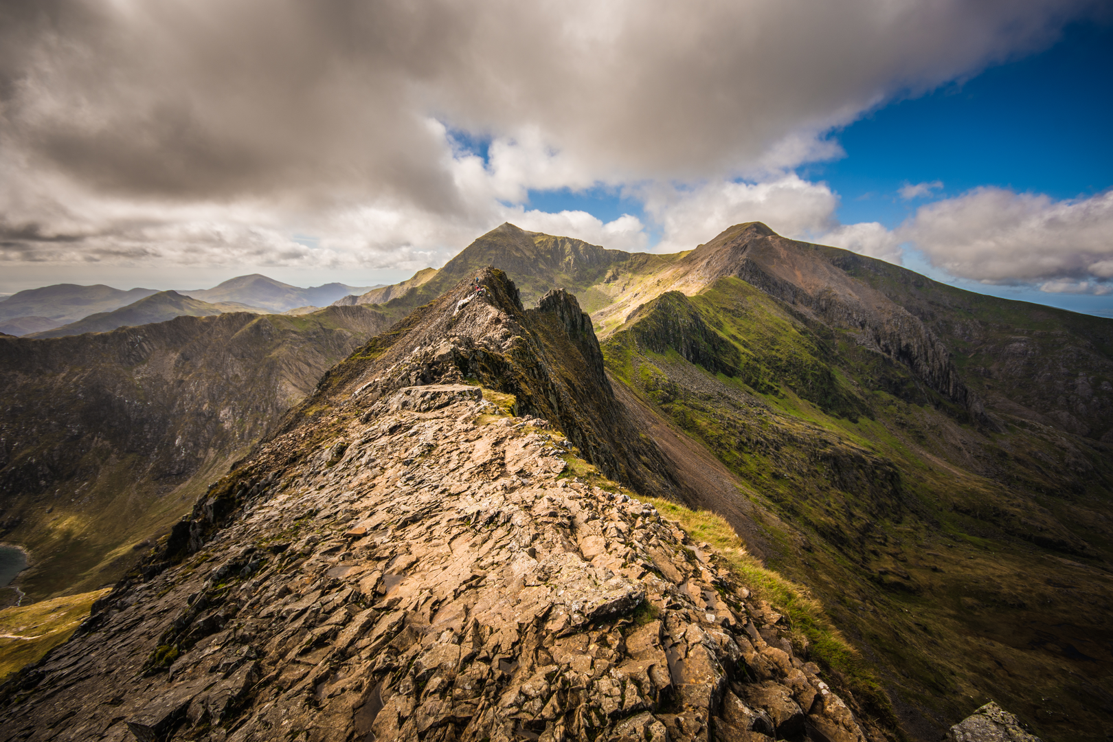 An image depicting the trail Snowdon via Crib Goch from Pen-y-pass and its surrounding area.