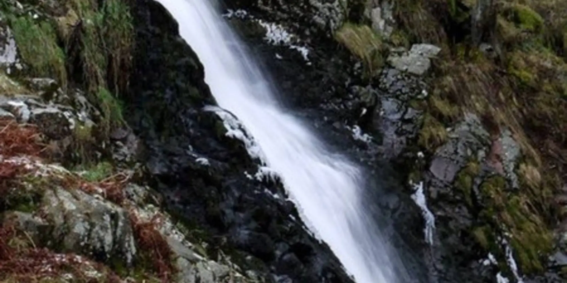 An image depicting the trail Linhope Spout Walk and its surrounding area.