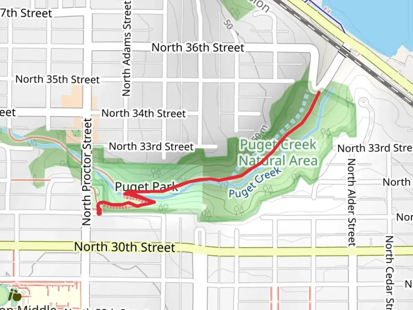 An image depicting the trail Proctor Street and Puget Canyon Trail and its surrounding area.