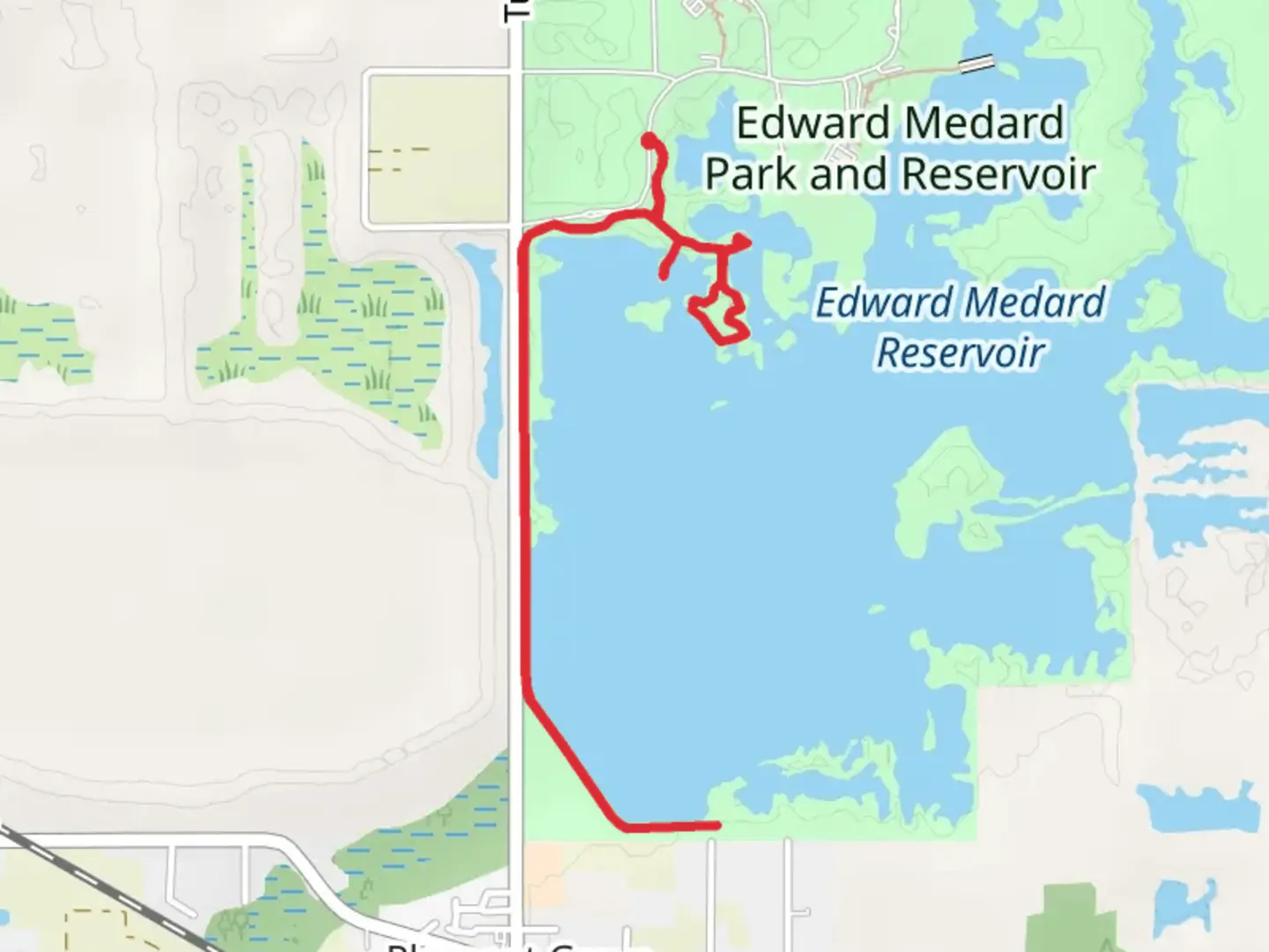 An image depicting the trail Walk along Edward Medard Park and Reservoir and its surrounding area.