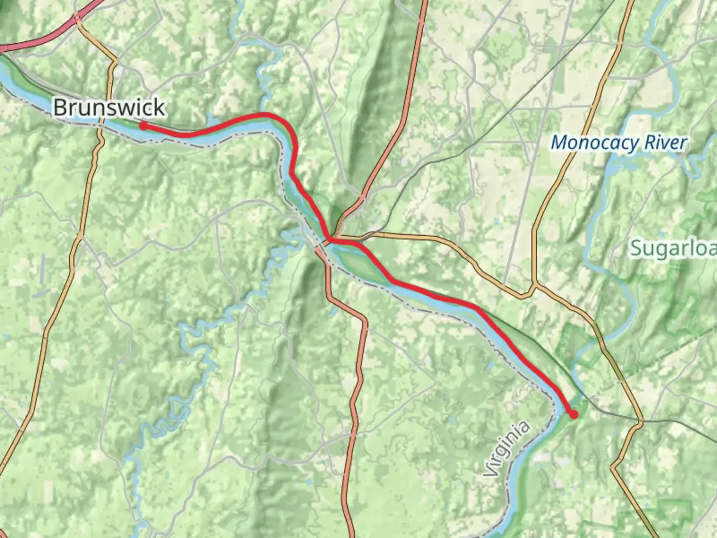 An image depicting the trail Chesapeake and Ohio Canal Trail and its surrounding area.