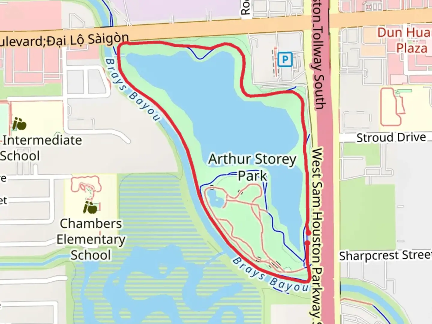 An image depicting the trail Arthur Storey Park Stormwater Detention Basin Loop and its surrounding area.