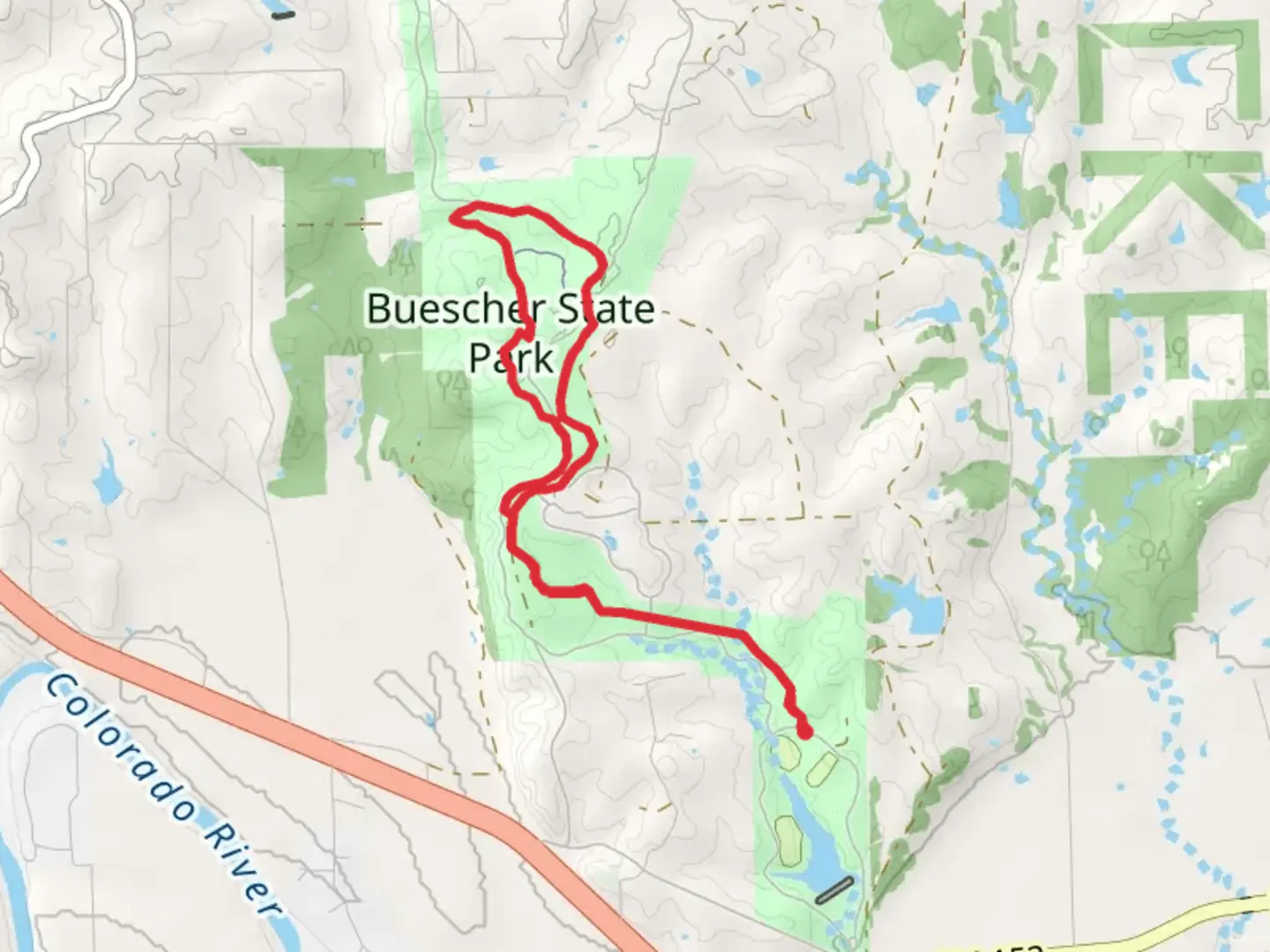 An image depicting the trail Buescher State Park via Winding Woodland Trail and its surrounding area.