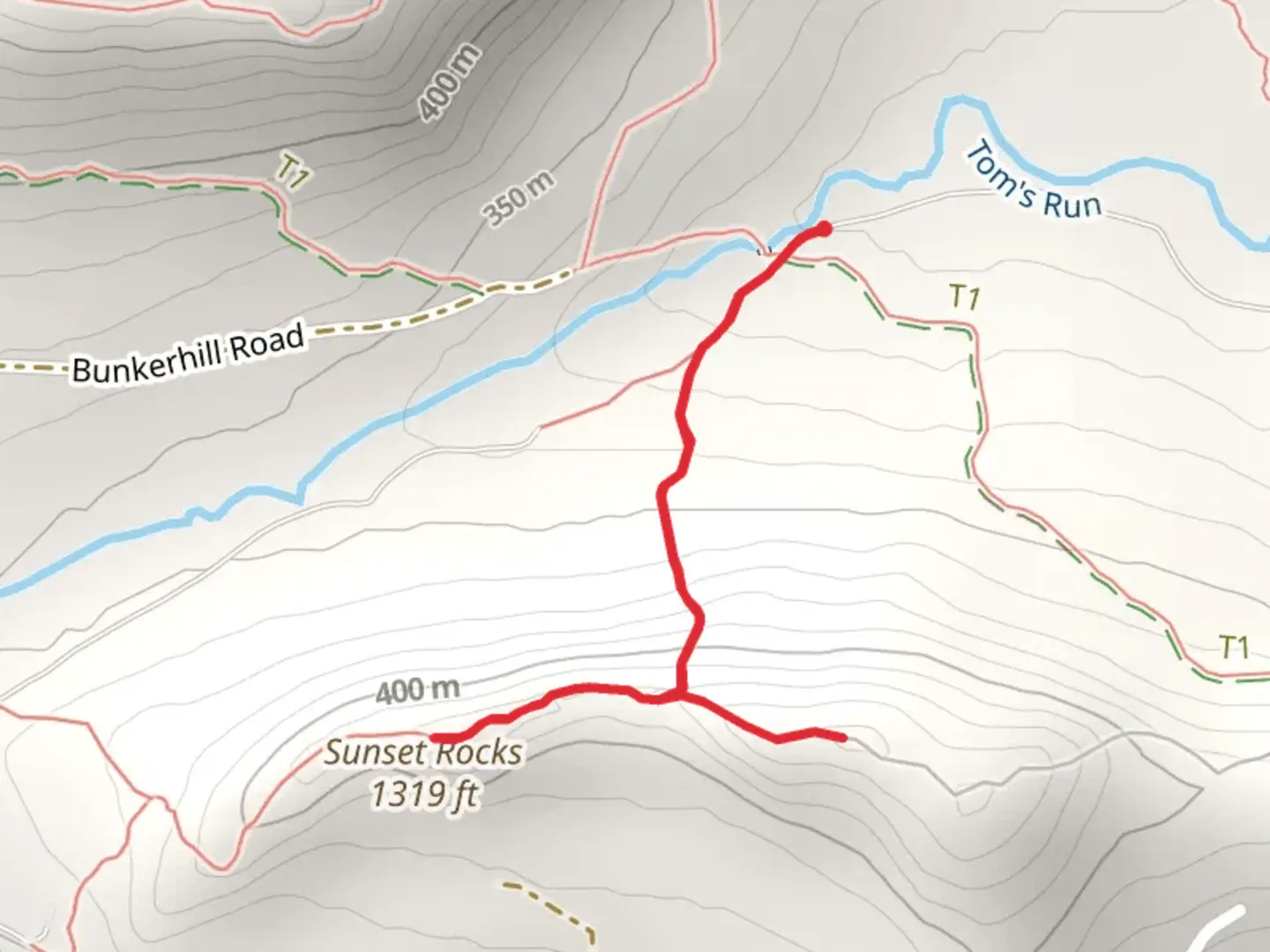 An image depicting the trail Sunsets Rocks Trail and its surrounding area.