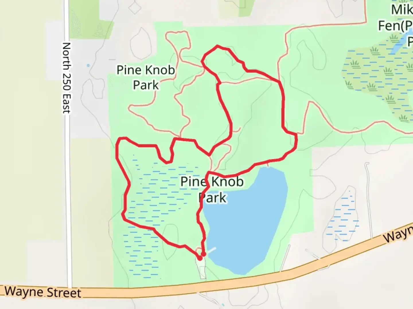 An image depicting the trail Pine Knob Green Park Loop and its surrounding area.