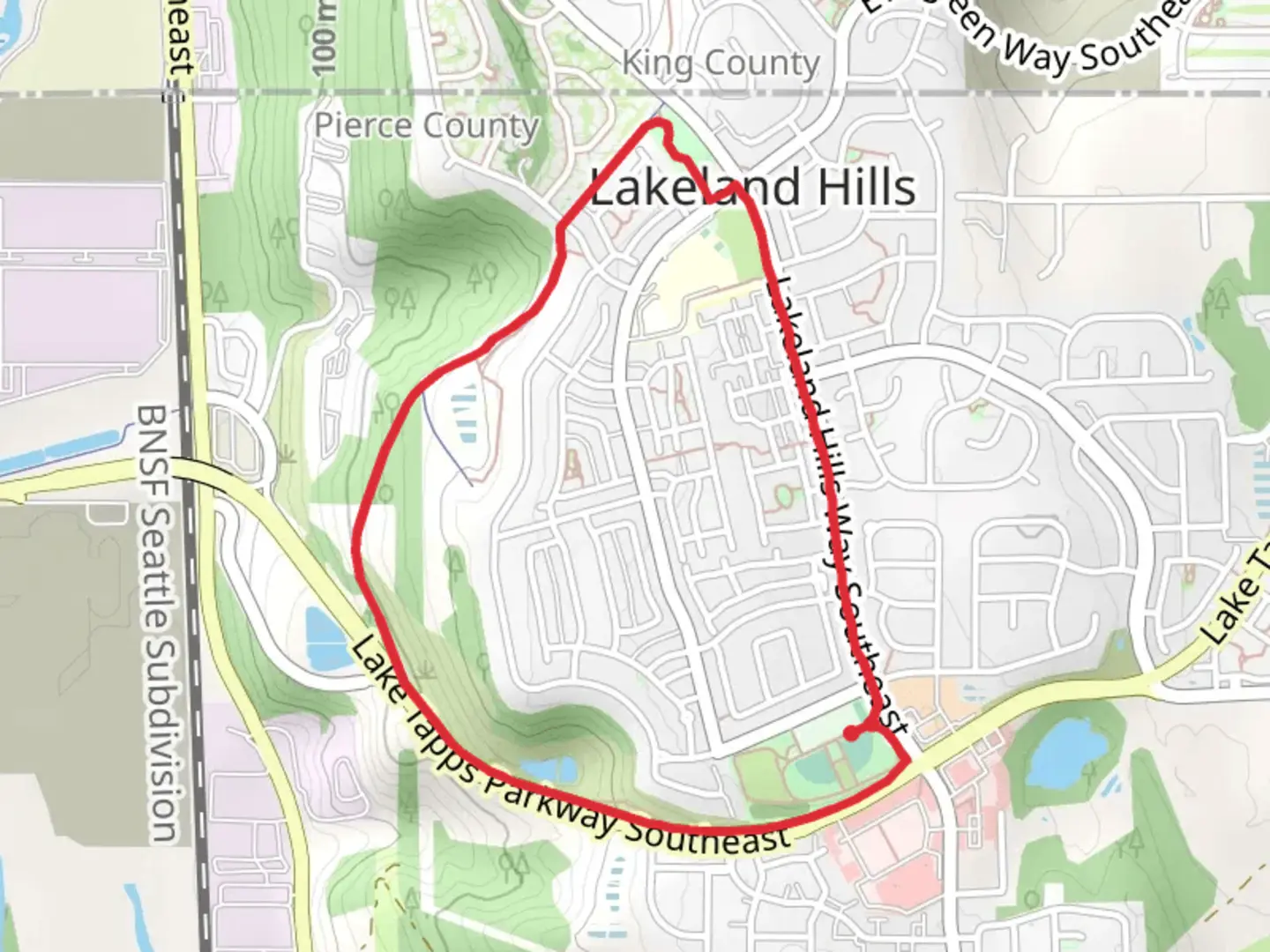 An image depicting the trail Lake Tapps Parkway Trail and its surrounding area.