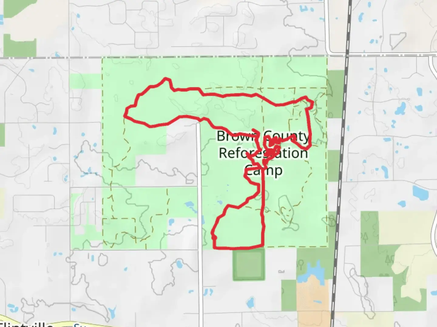 An image depicting the trail Oaks Loop - Brown County Reforestation Camp and its surrounding area.