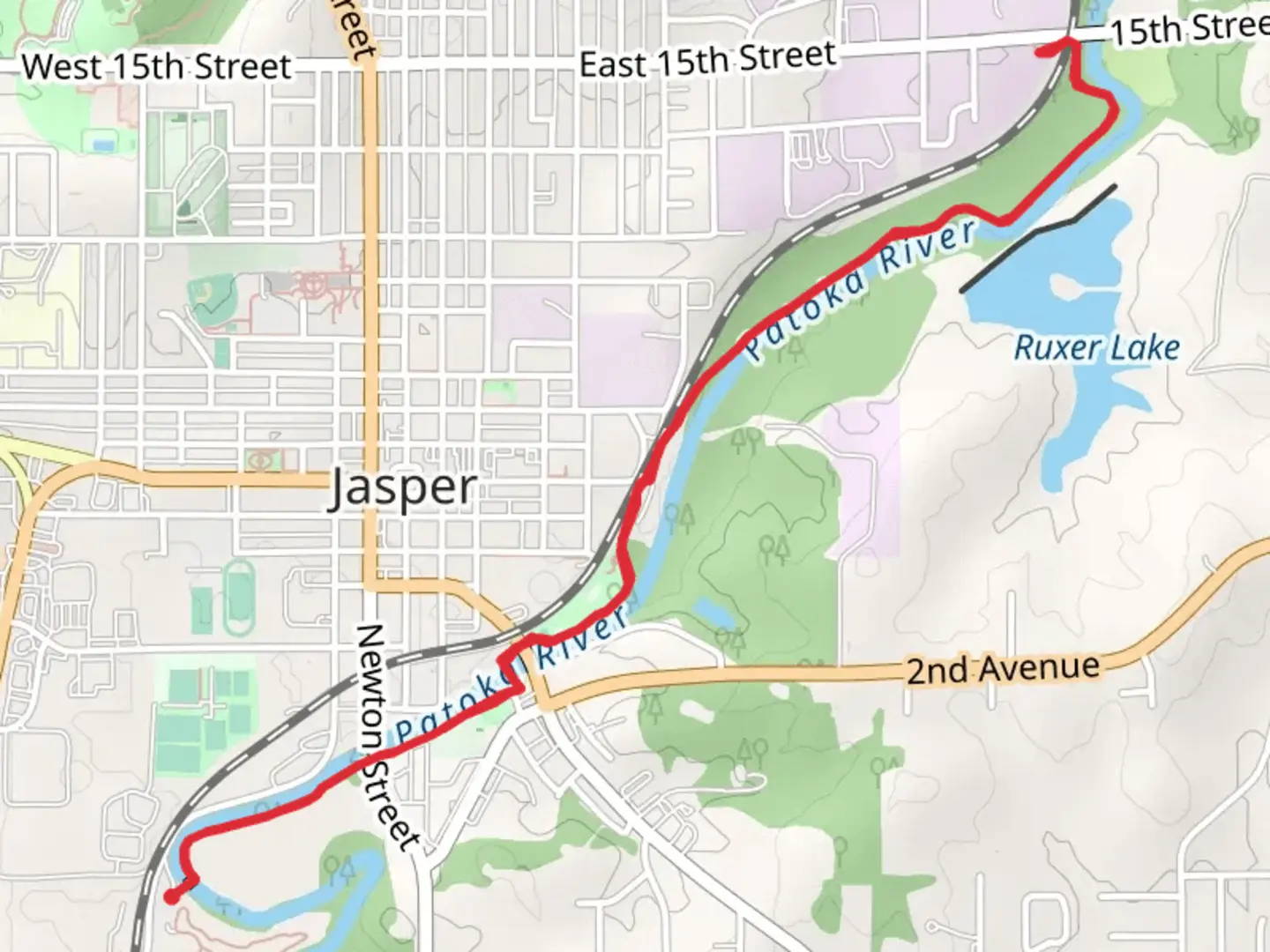 An image depicting the trail Patoka River via Jasper RiverWalk and its surrounding area.