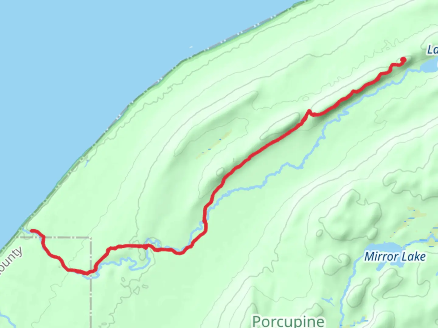 An image depicting the trail Big Carp River Trail and its surrounding area.