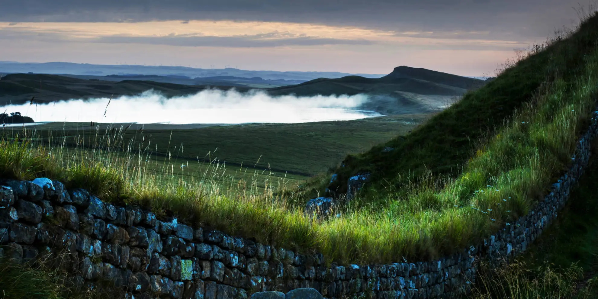 An image depicting the trail Cragend and Crow Crags from Housesteads and its surrounding area.