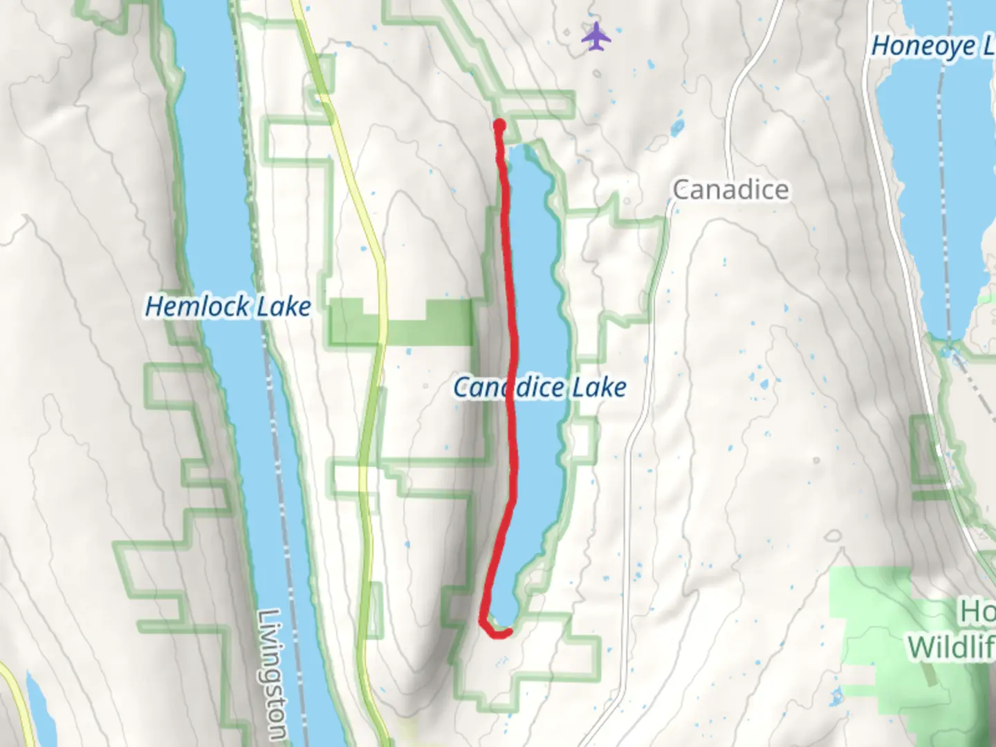 An image depicting the trail Canadice Lake and its surrounding area.