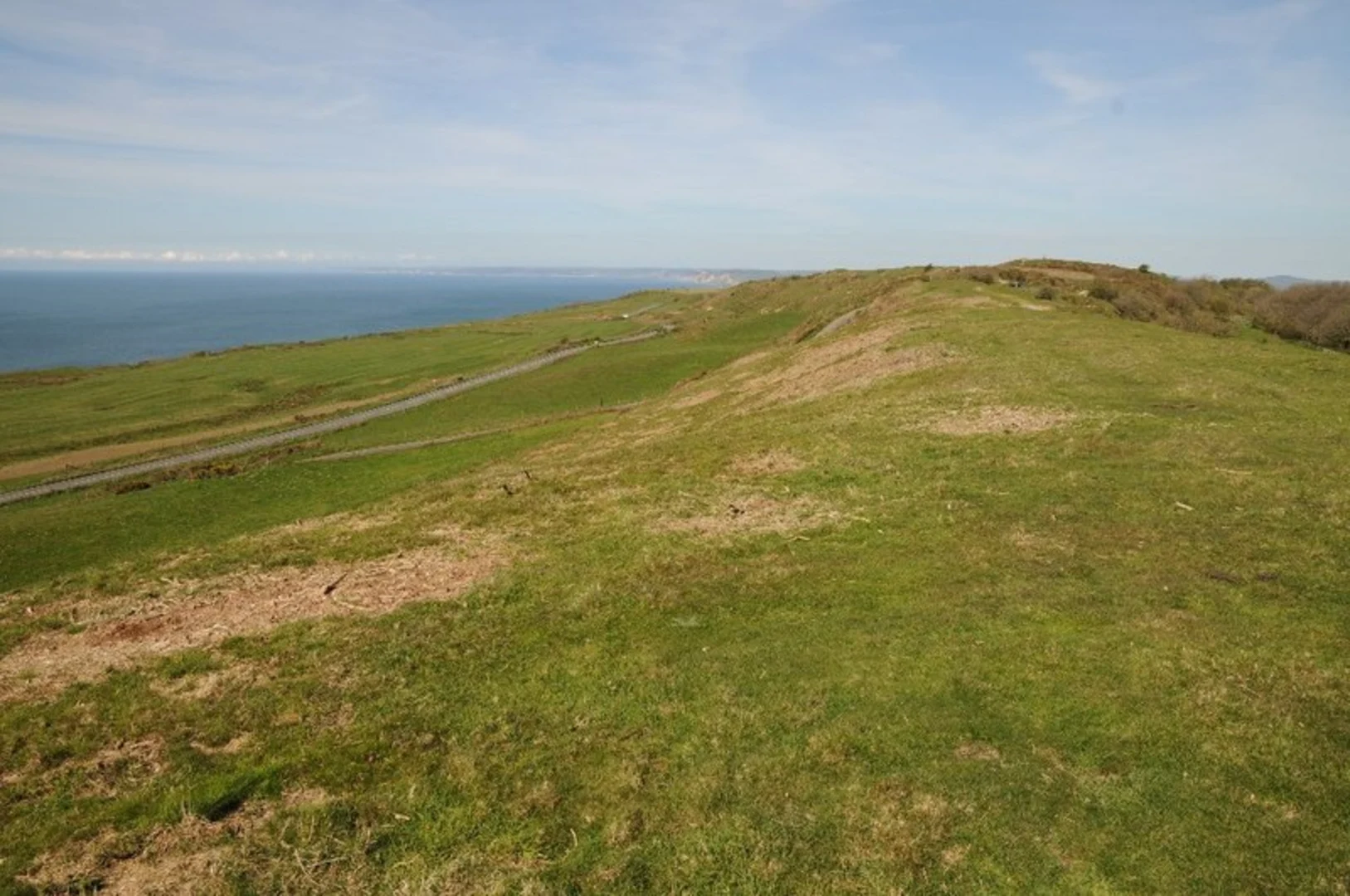 An image depicting the trail Abbotsbury Castle Walk and its surrounding area.