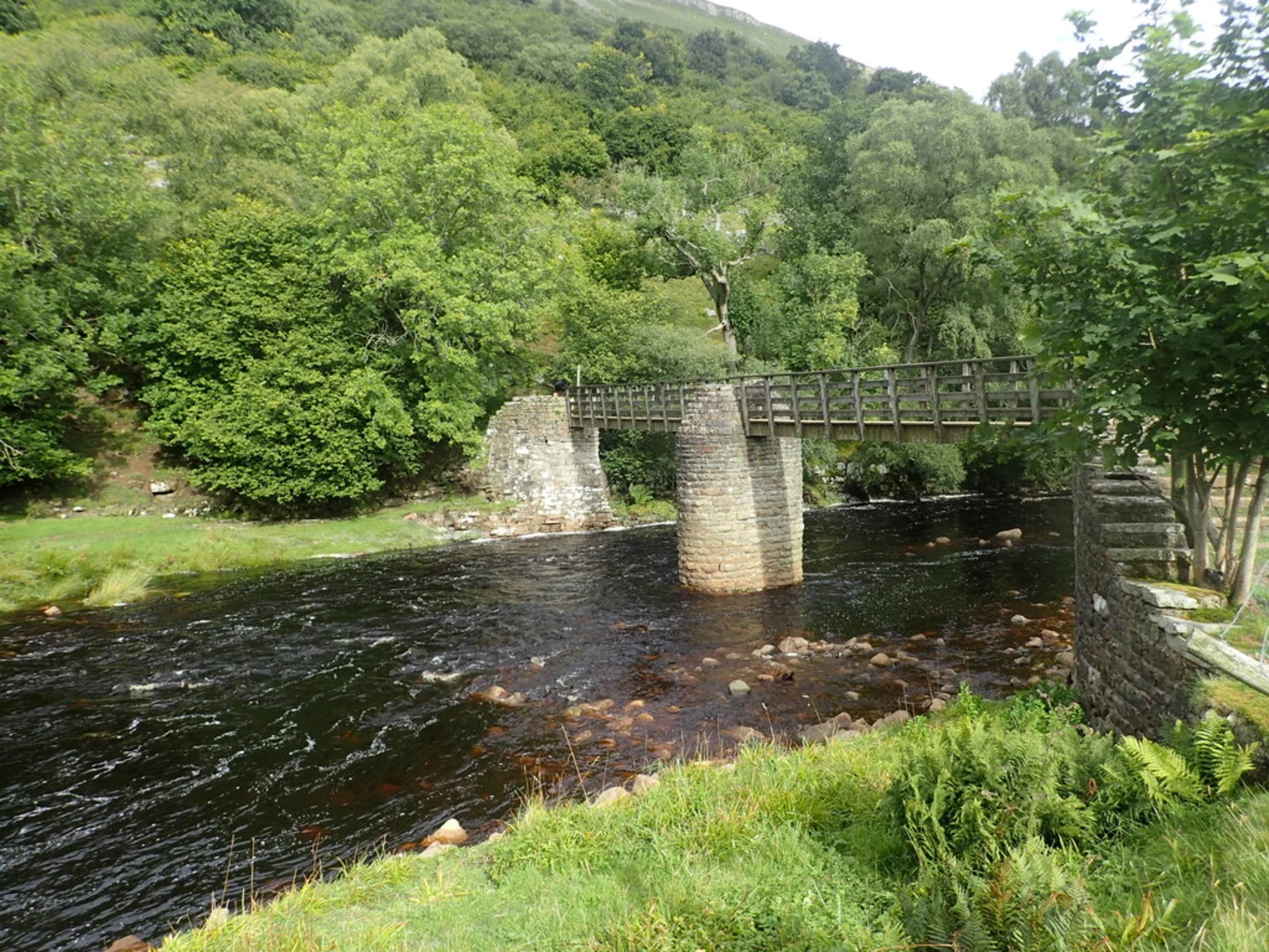 An image depicting the trail Muker to Gunnerside Loop and its surrounding area.