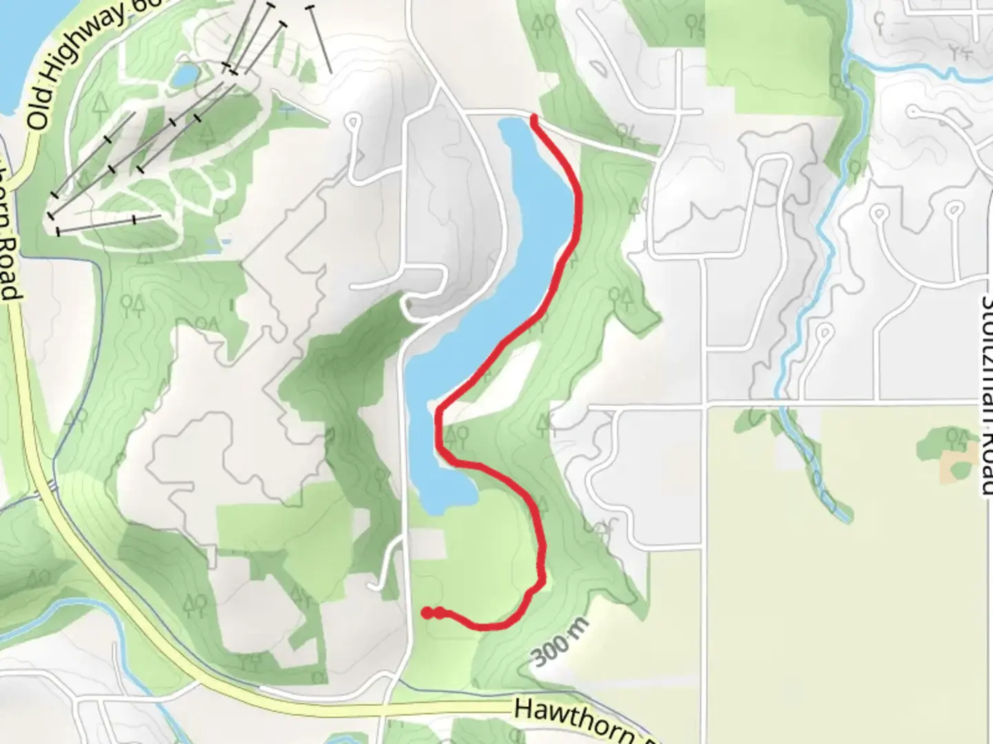 An image depicting the trail Indian Lake Park Foot Path and its surrounding area.