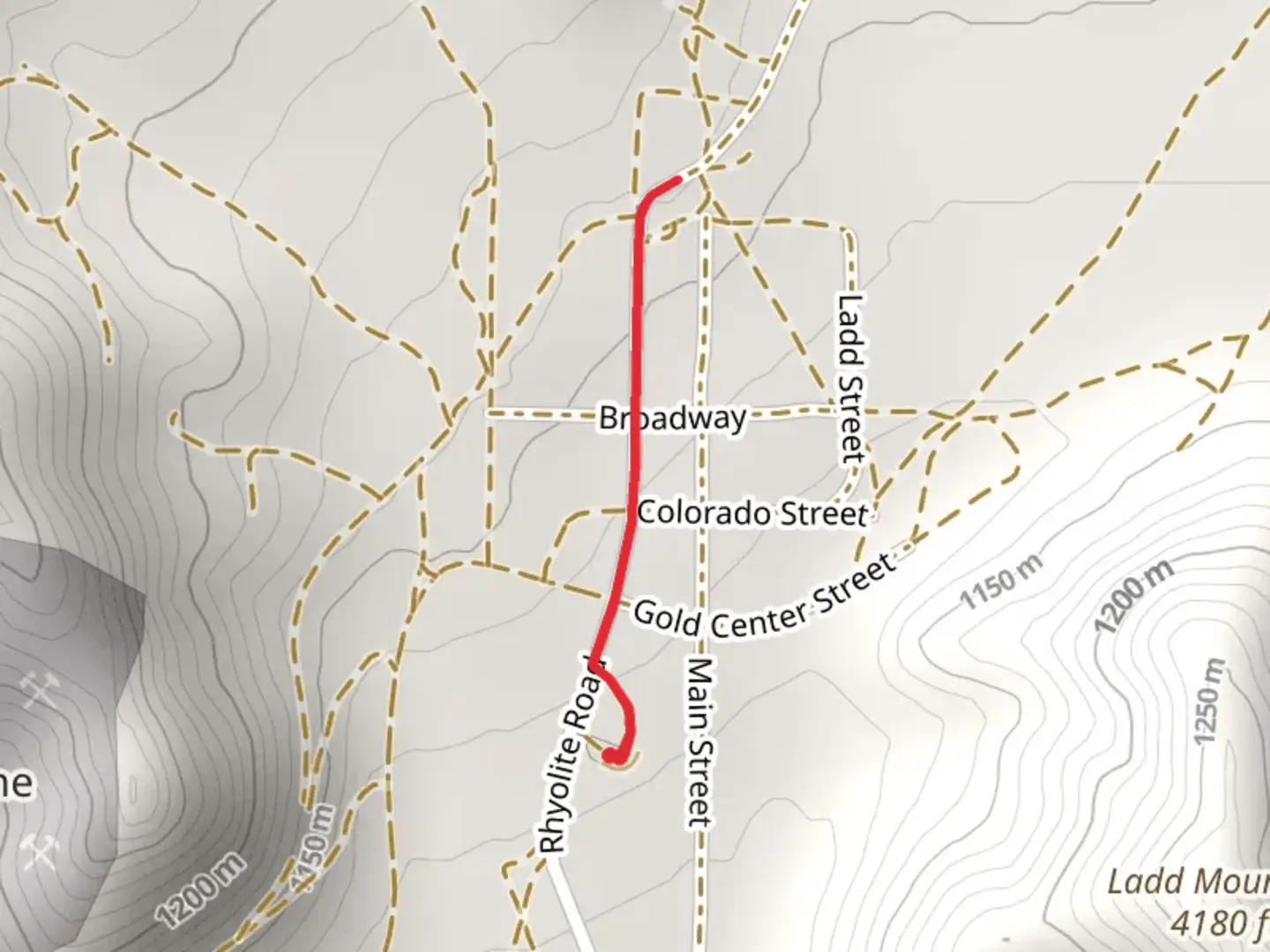 An image depicting the trail Rhyolite Road and its surrounding area.