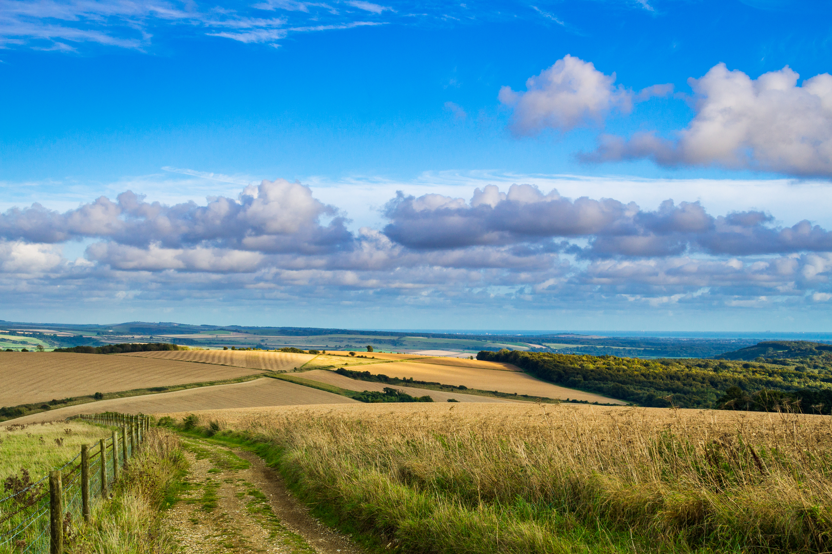 An image depicting the trail Bignor Hill and The Denture from Amberley and its surrounding area.