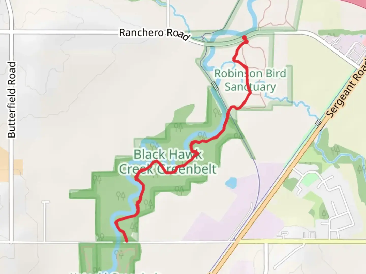 An image depicting the trail Walk along Black Hawk Creek from Ranchero Road and its surrounding area.