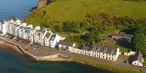 An image depicting the trail Cushendun Long Walk and its surrounding area.