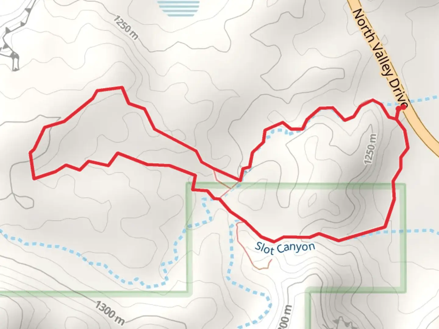 An image depicting the trail Slot Canyon Loop and its surrounding area.