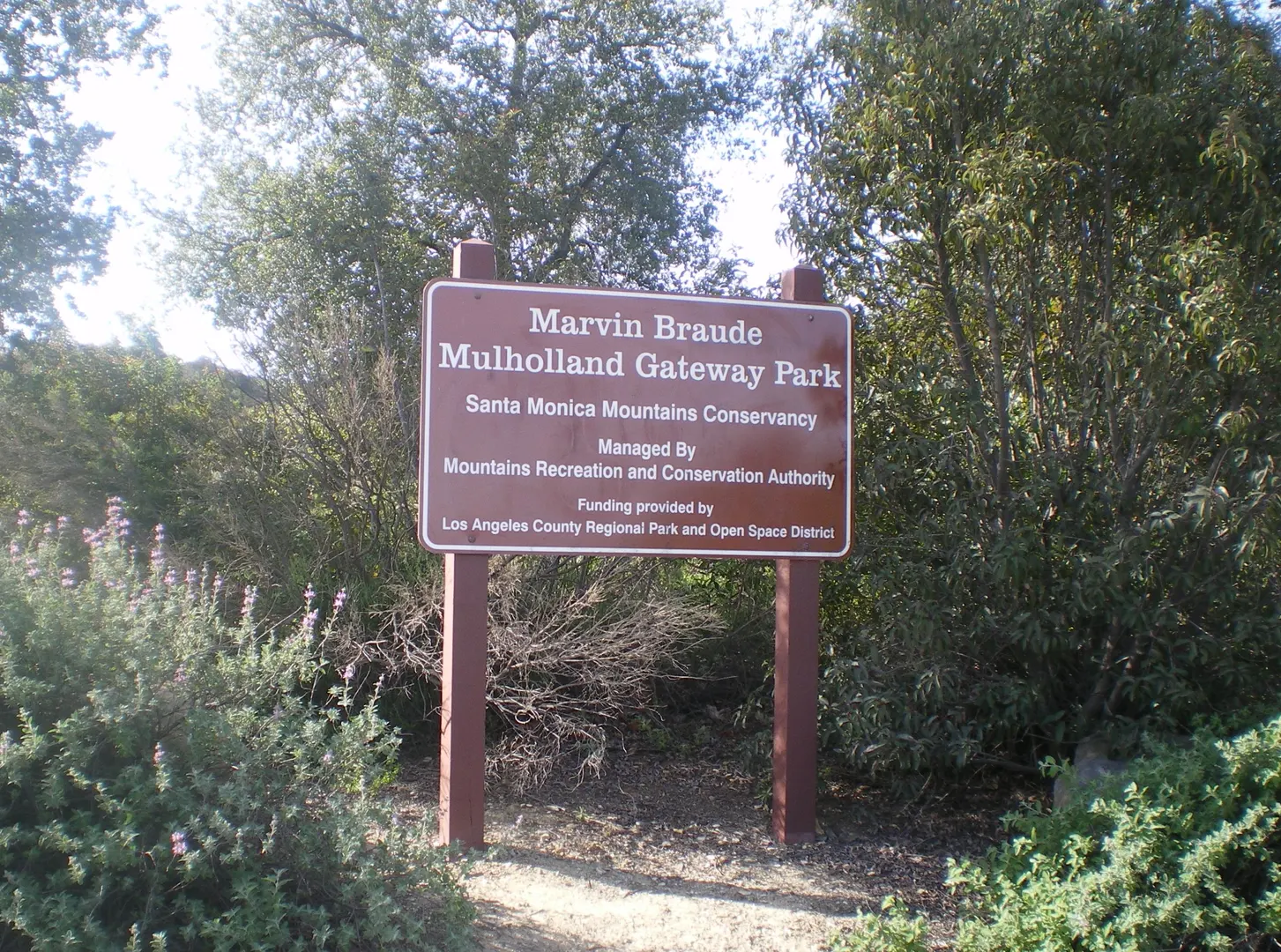 An image depicting the trail Mulholland Drive - Caballero Canyon Loop Trail and its surrounding area.