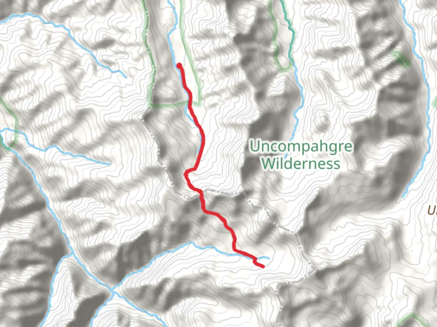 An image depicting the trail Wetterhorn Basin Trail and its surrounding area.