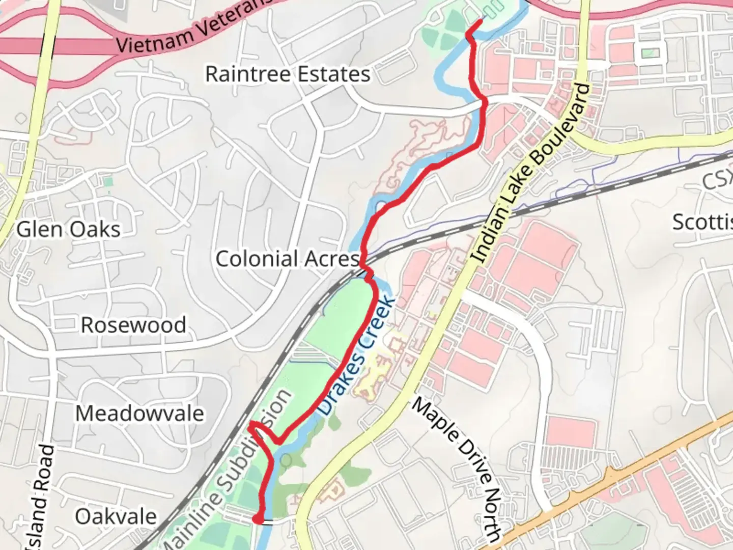 An image depicting the trail Veterans Park - Hendersonville Greenway and its surrounding area.