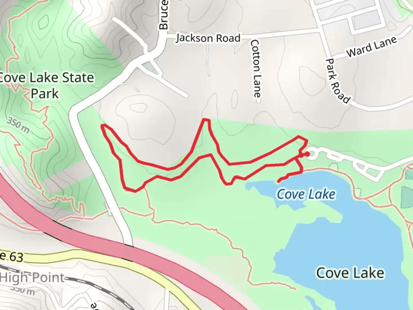 An image depicting the trail Paved Loop Trail and Cove Lake and its surrounding area.