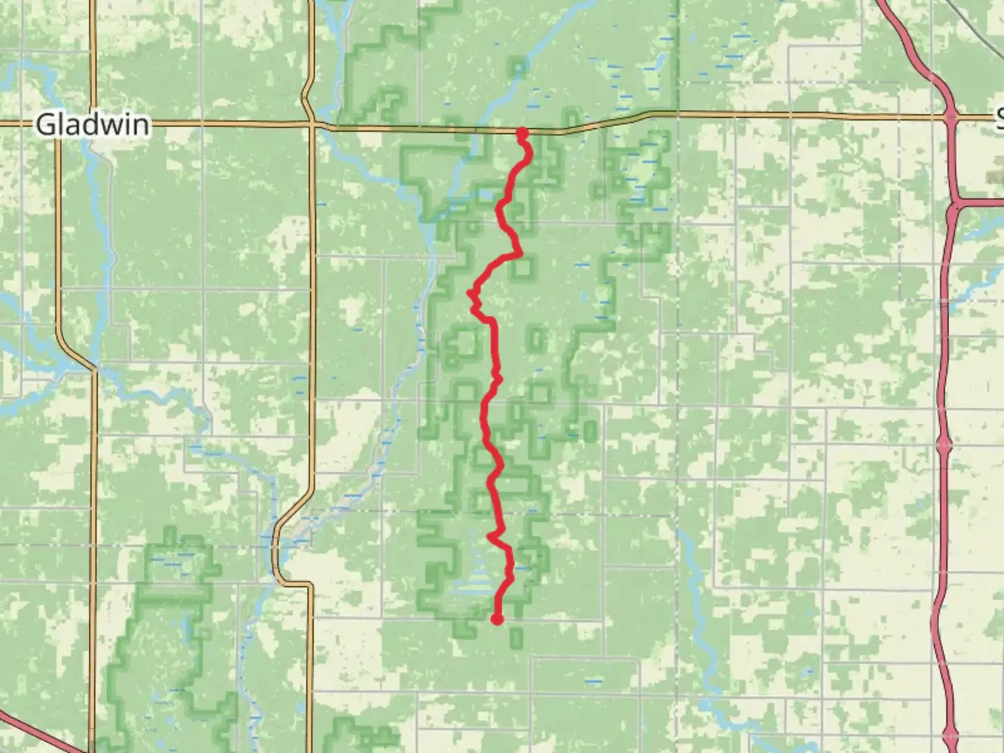 An image depicting the trail Midland to Mackinaw Trail from E Shearer Road to M 61 and its surrounding area.