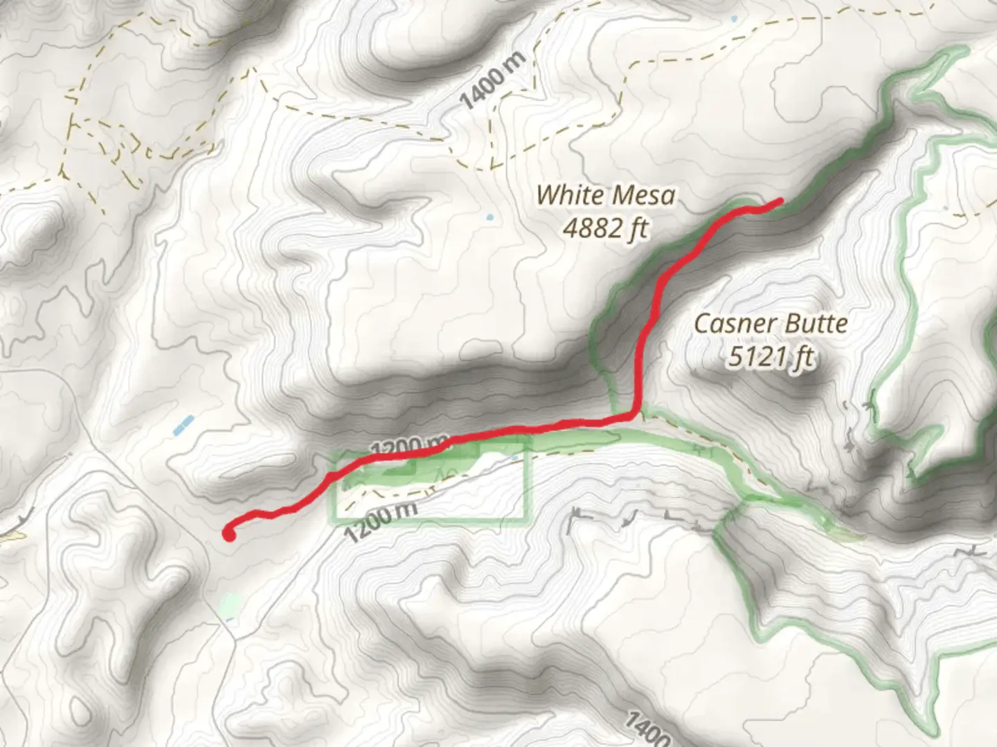 An image depicting the trail White Mesa from Beaver Creek Road and its surrounding area.