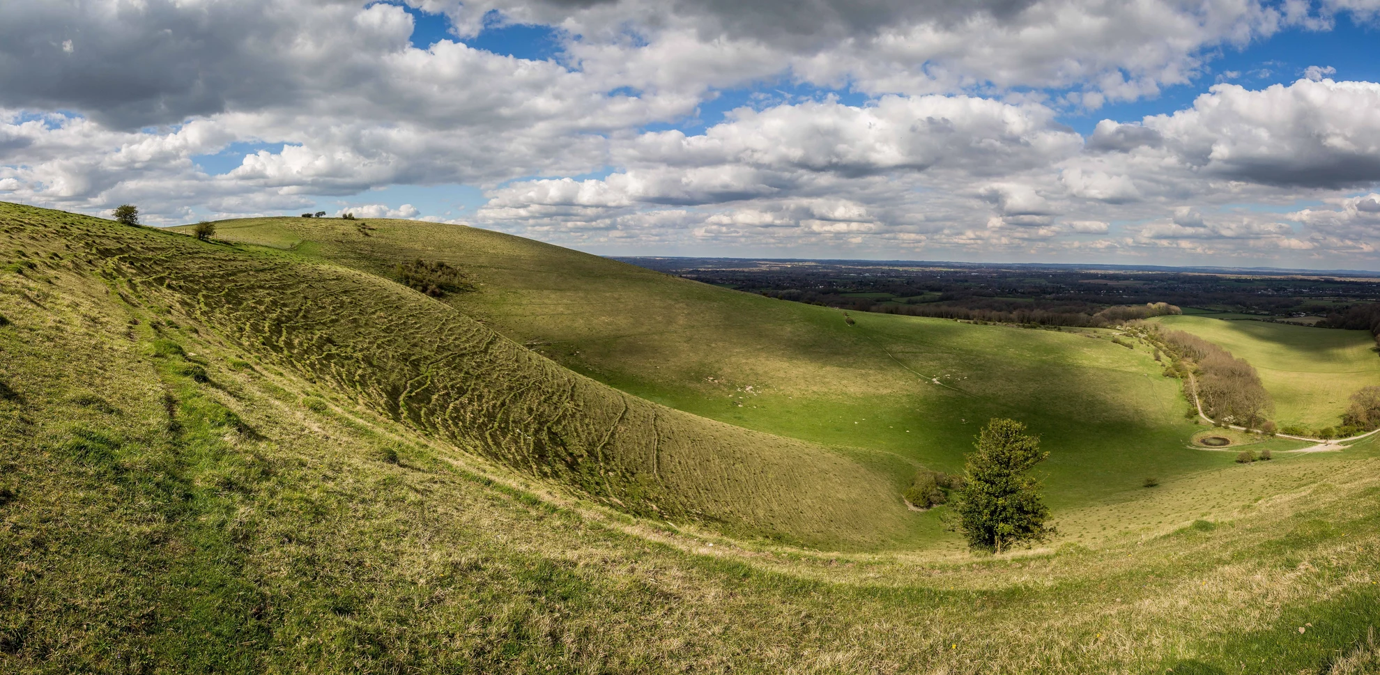 An image depicting the trail Wolstonbury Hill and Pyecombe from Patcham and its surrounding area.