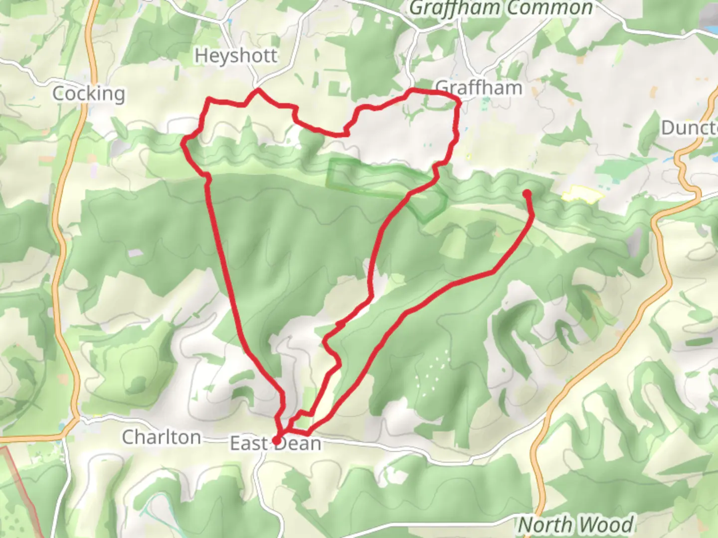 An image depicting the trail East Dean Northern Loop via Heyshott Down and its surrounding area.