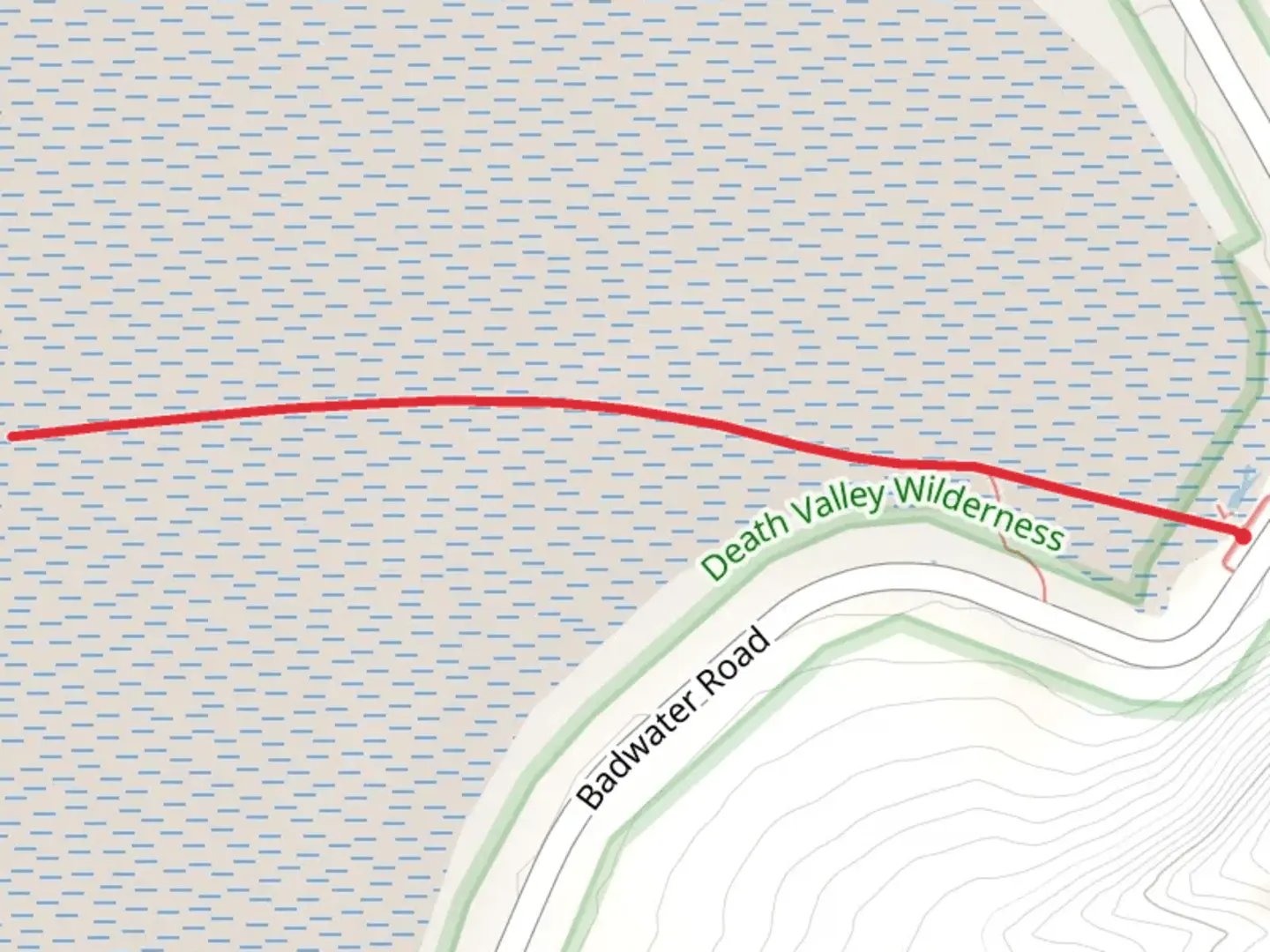 An image depicting the trail Badwater Salt Flats and its surrounding area.