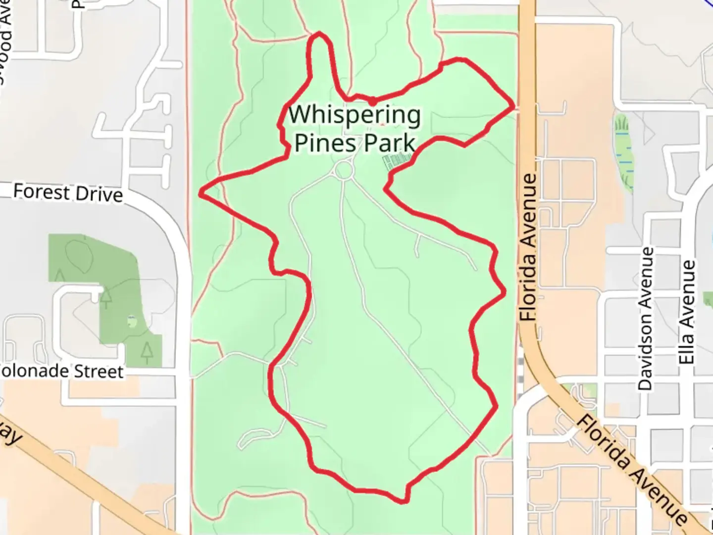 An image depicting the trail Whispering Pines Park Green and Yellow Loop Trail and its surrounding area.