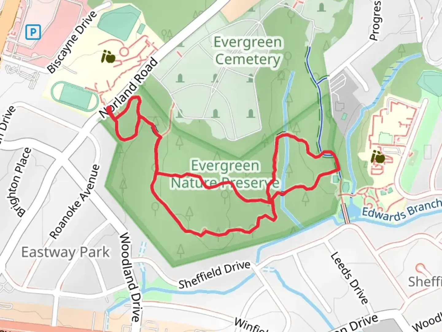 An image depicting the trail Evergreen and Tuliptree Loop Trail and its surrounding area.