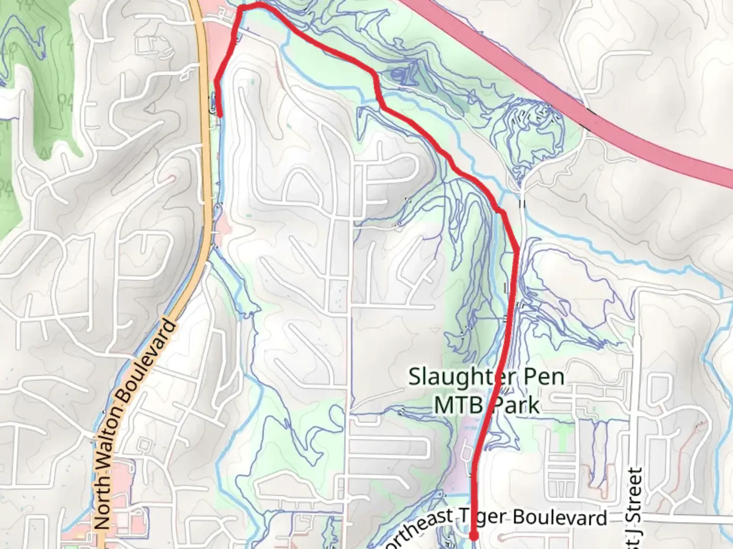 An image depicting the trail Razorback Regional Greenway and its surrounding area.