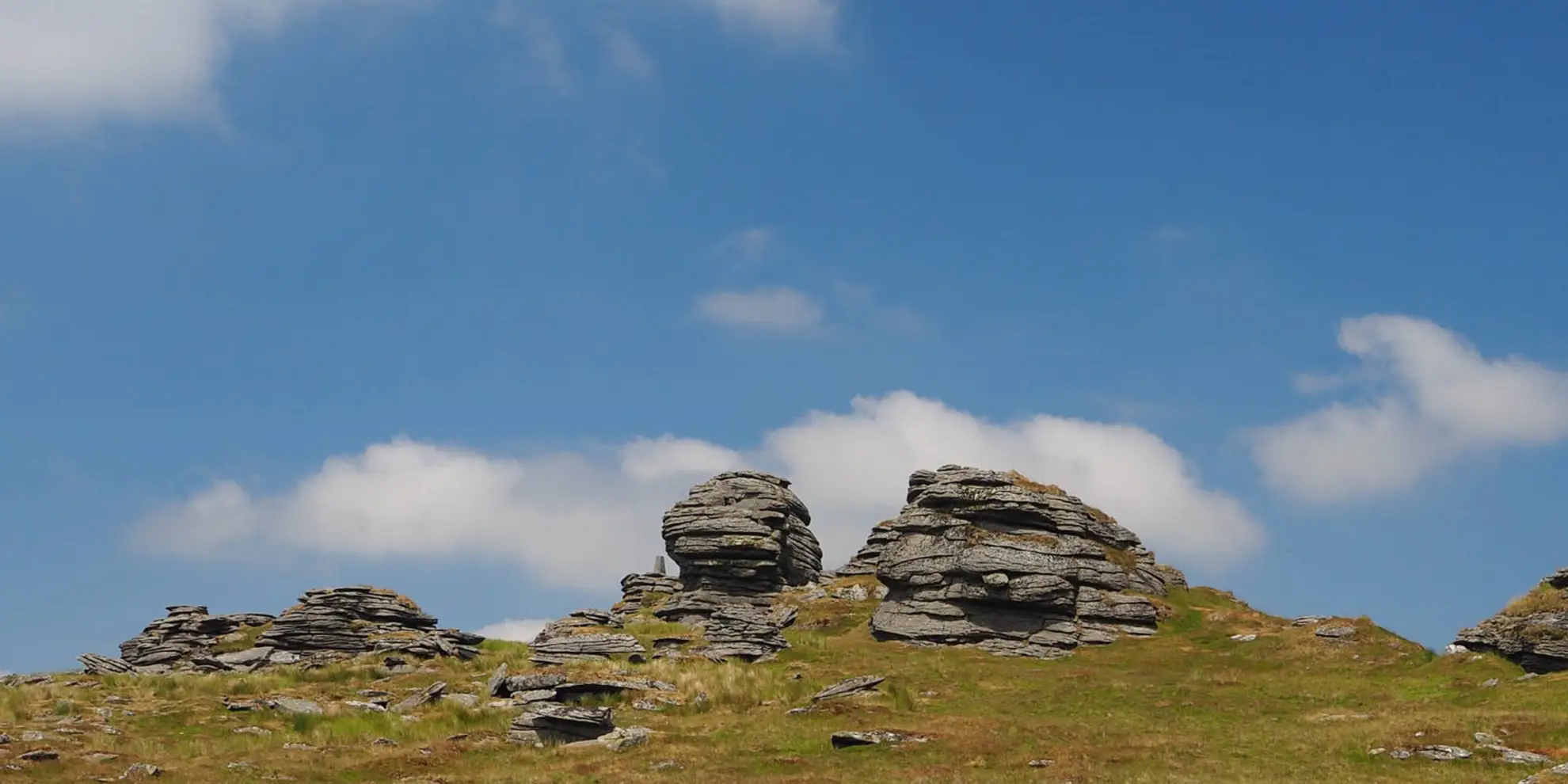 An image depicting the trail Great Links Tor and Widgery Cross from The Fox and Hounds and its surrounding area.