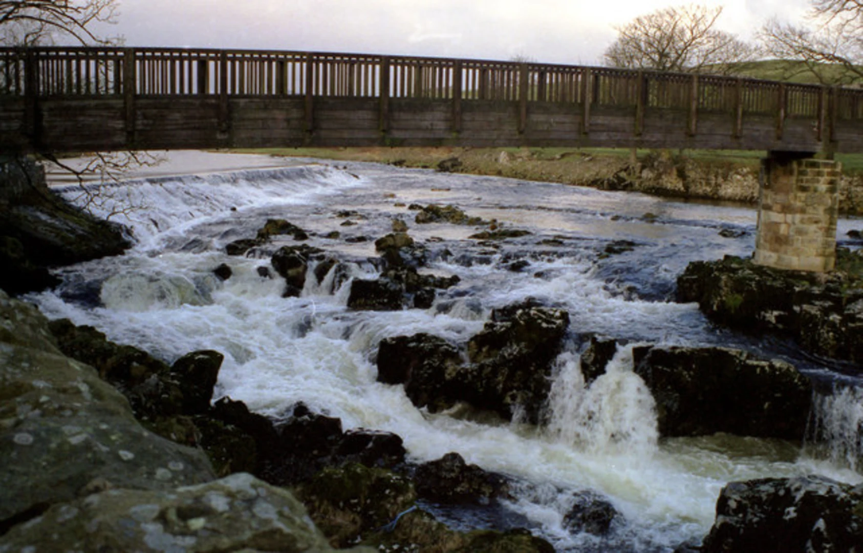 An image depicting the trail River Wharfe via Dales Way and its surrounding area.