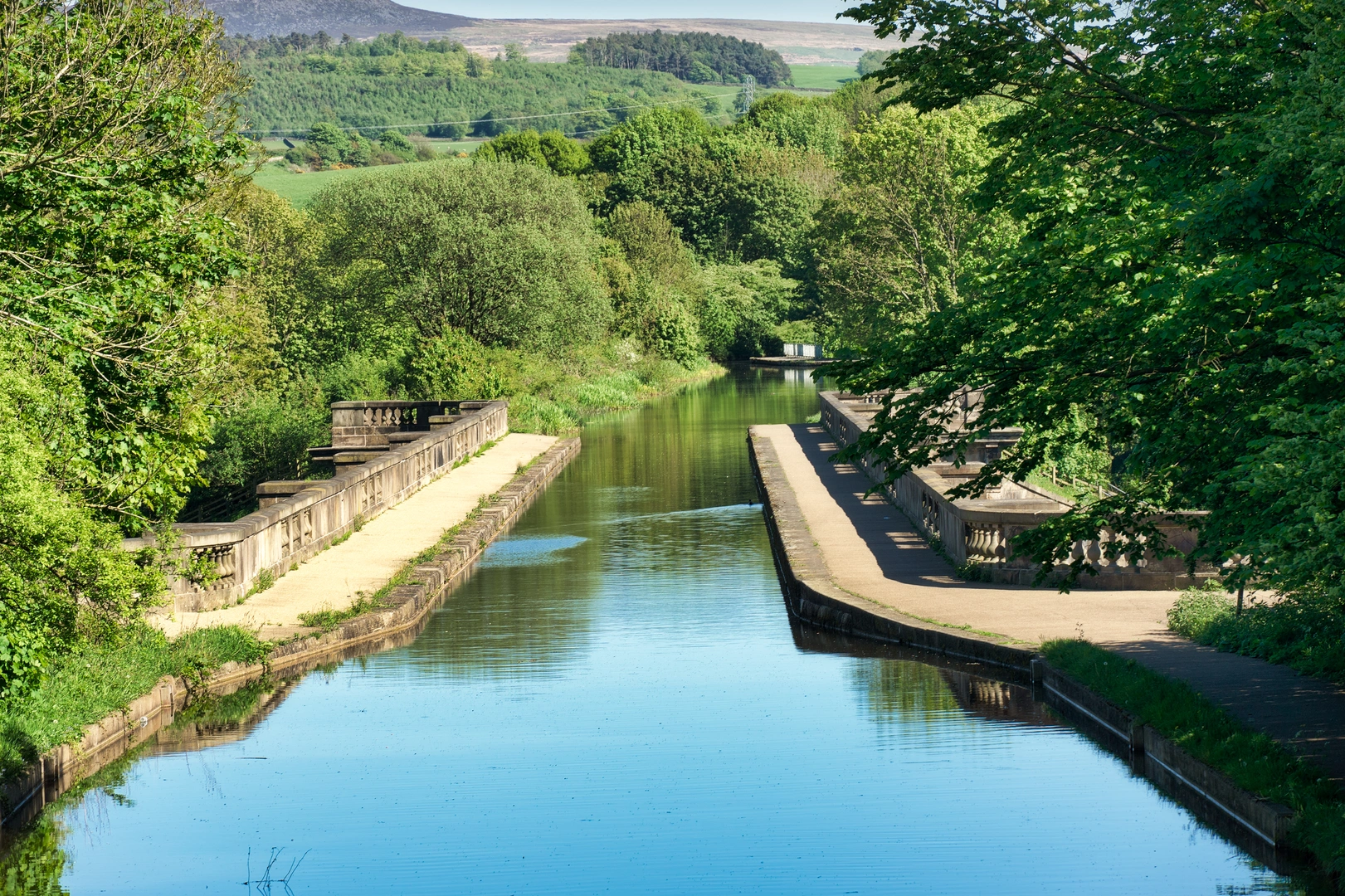 An image depicting the trail Lancaster Canal Walk in Lancashire and its surrounding area.