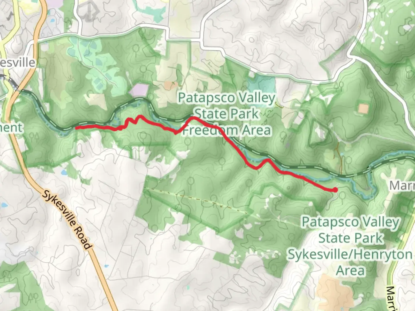 An image depicting the trail HoCo Thru Trail from Henryton Road and its surrounding area.