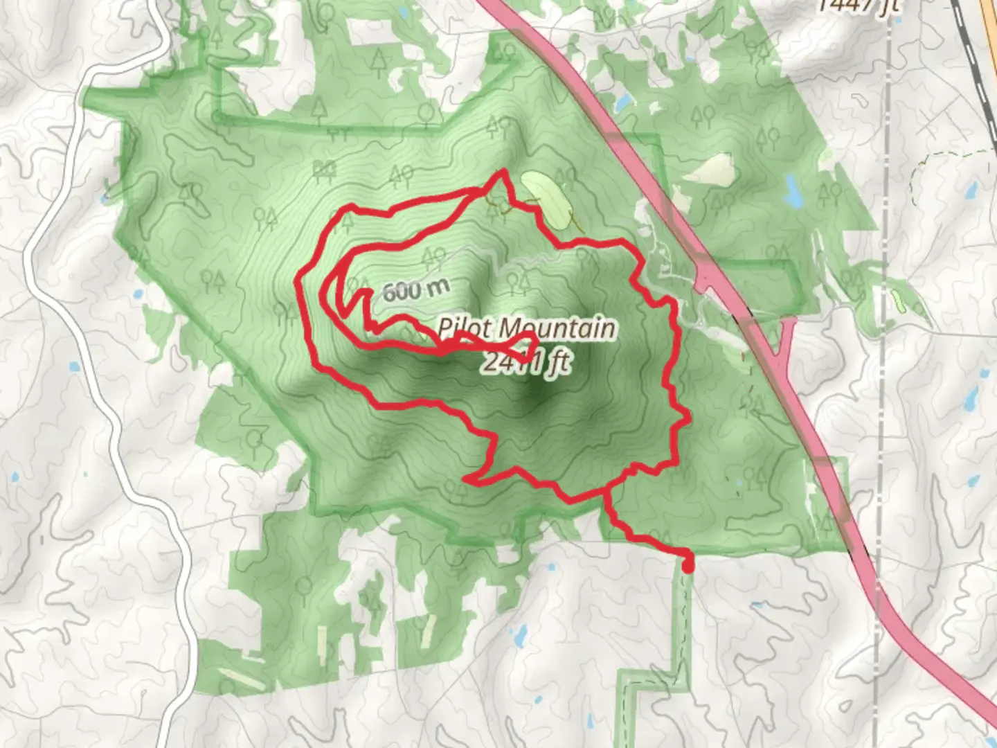 An image depicting the trail Pilot Mountain Loop via Ledge Spring Trail and Grindstone Trail and its surrounding area.