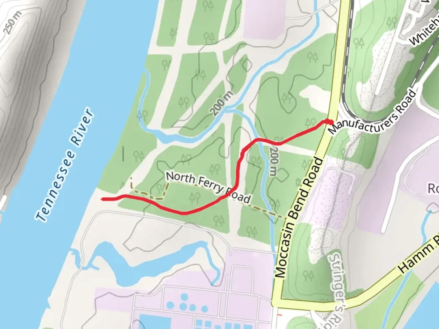 An image depicting the trail Pineville Road and its surrounding area.