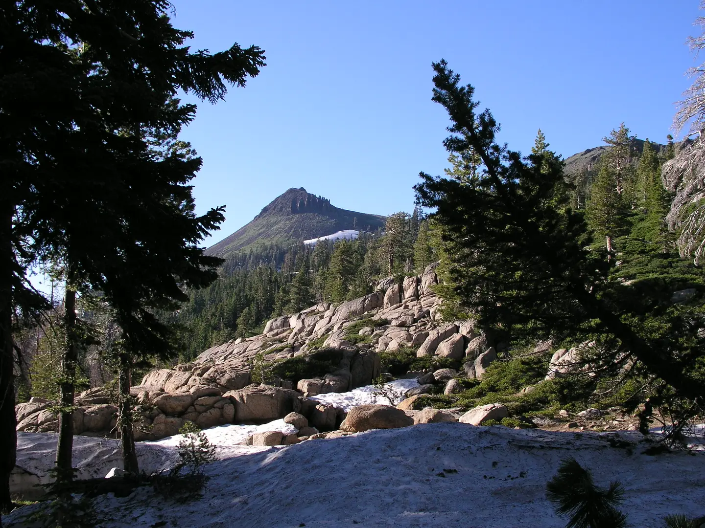 An image depicting the trail Tinker Knob via Granite Chief Trail and its surrounding area.