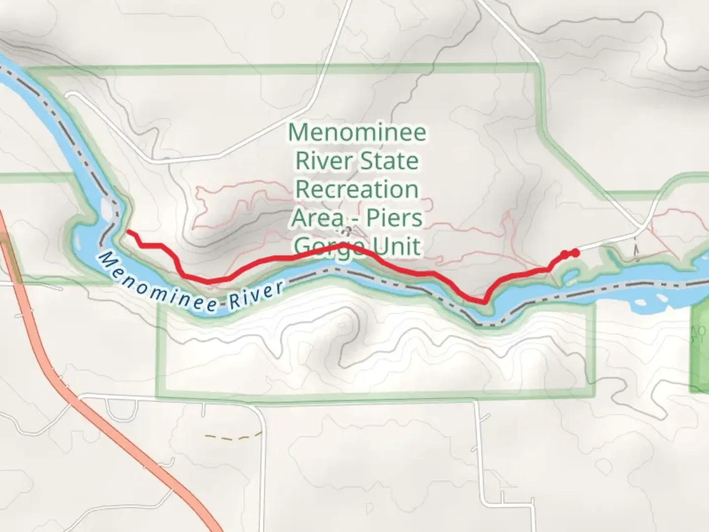 An image depicting the trail Menominee River Walk and its surrounding area.