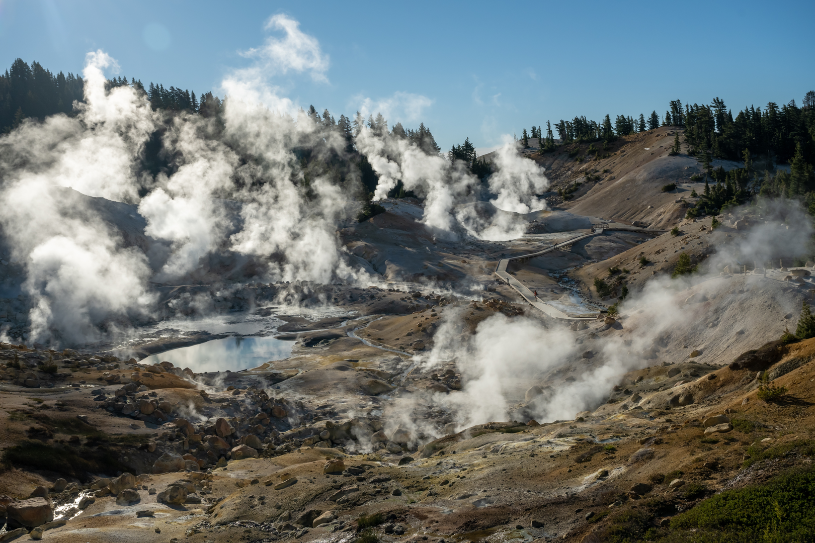 An image depicting the trail Bumpass Hell and Bumpass Hell Boardwalk Loop Trail and its surrounding area.