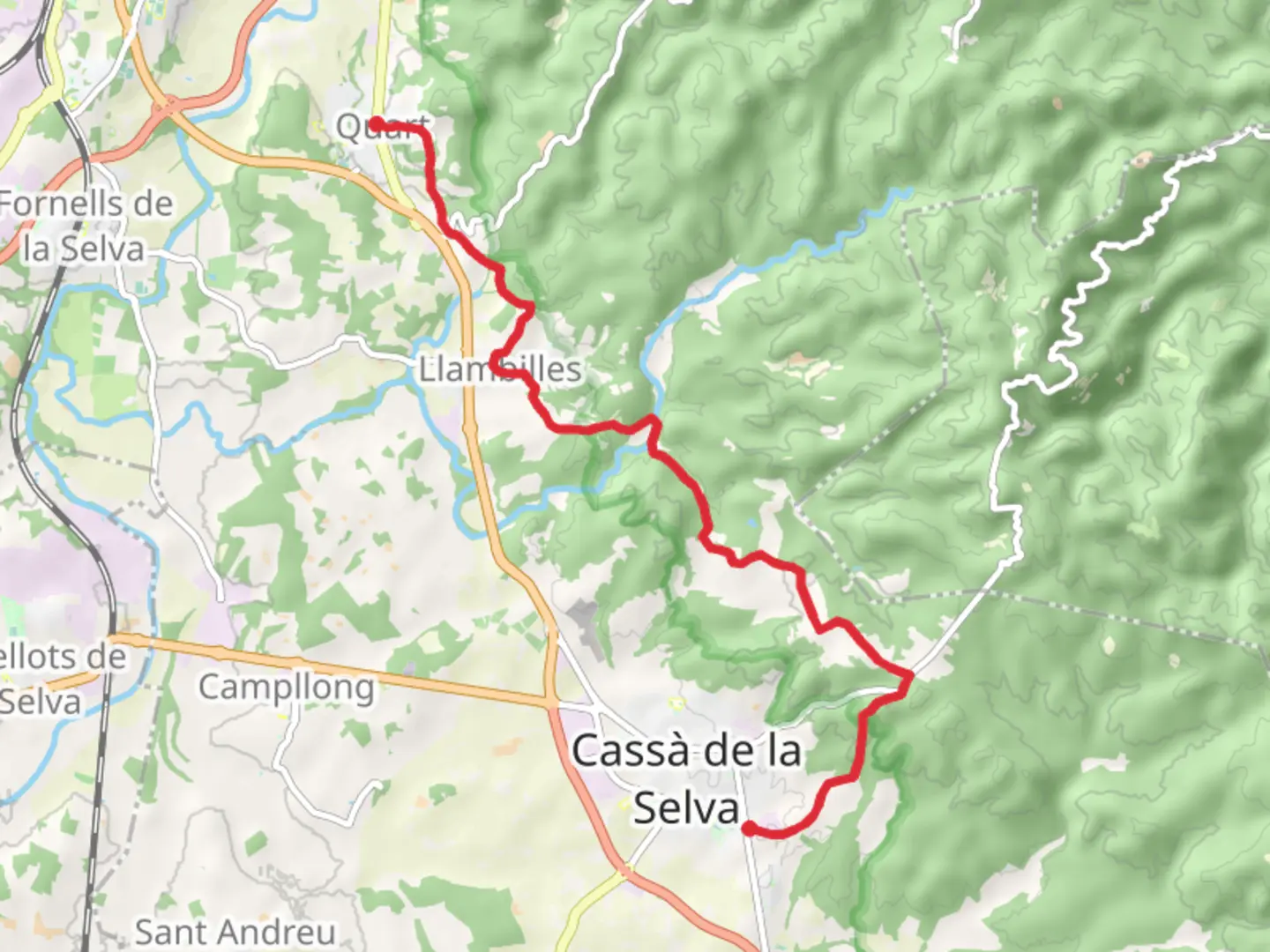 An image depicting the trail Quart - Cassa de la Selva PR C 191 and its surrounding area.