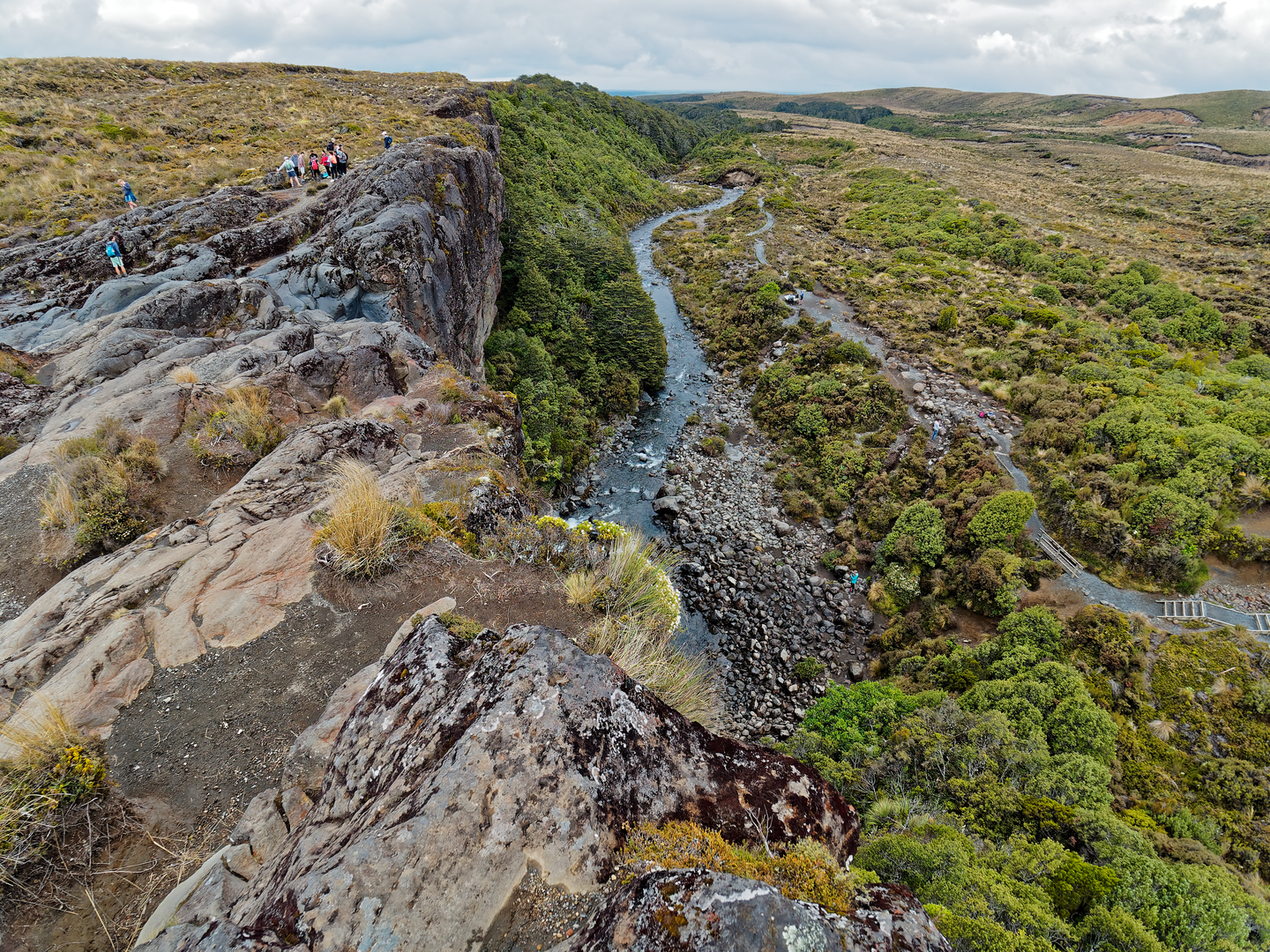 An image depicting the trail Tama Lakes Track via Taranaki Falls Loop and its surrounding area.