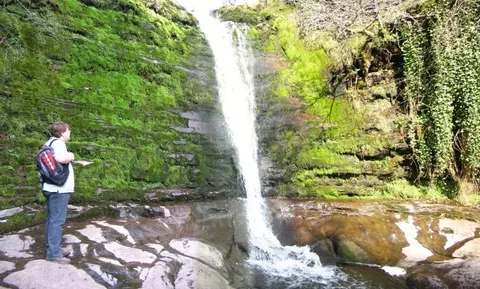 An image depicting the trail Blaen y Glyn Waterfalls Walk and its surrounding area.