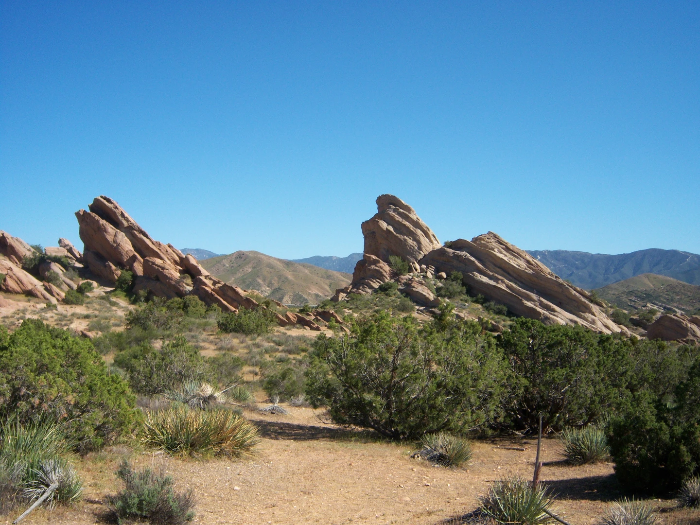 An image depicting the trail Pacific Crest Trail from Vasquez Rocks and its surrounding area.