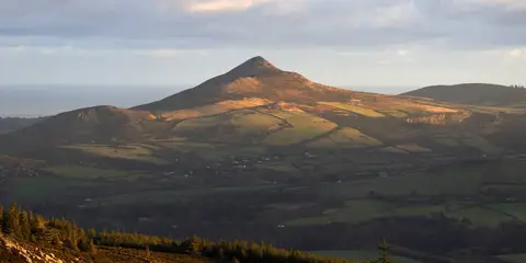 An image depicting the trail The Sugar Loaf Trail and its surrounding area.