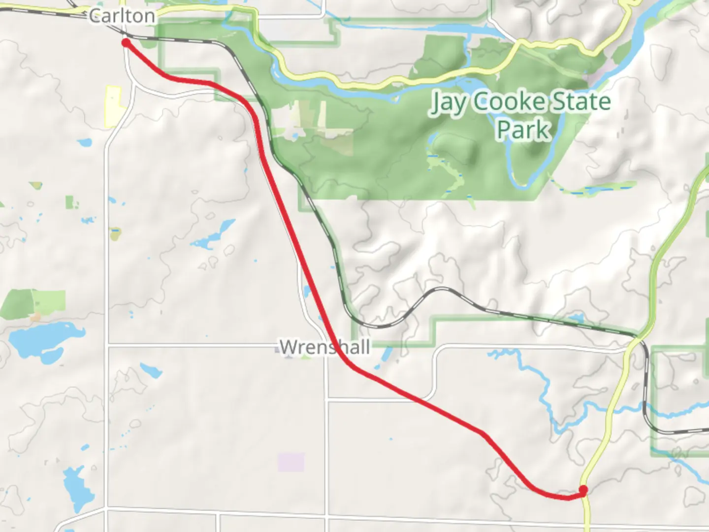 An image depicting the trail Alex Laveau memorial Trail - Veterans' Evergreen Memorial Drive and its surrounding area.